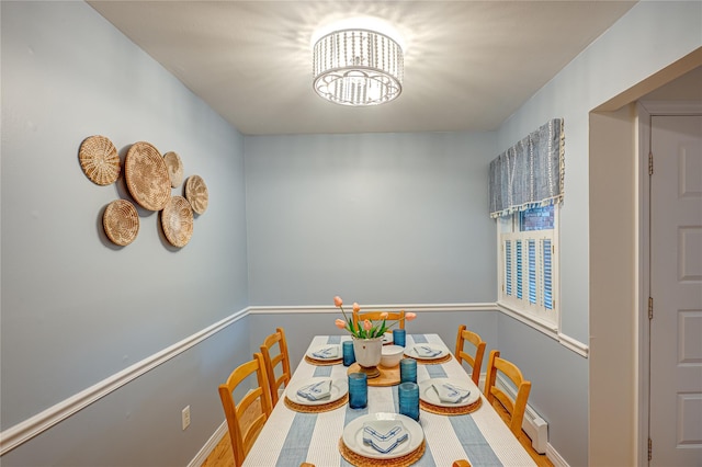 199 Millard Ave Unit 199, West Babylon, NY 11704 - dining area featuring baseboards and a chandelier
