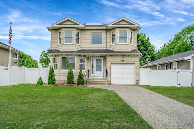 130 W 7th St, Deer Park, NY 11729 - view of front of home featuring a gate, asphalt driveway, a garage, a shingled roof, and solar panels