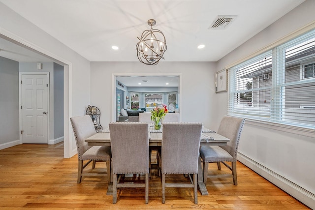 130 W 7th St, Deer Park, NY 11729 - dining area with baseboard heating, a chandelier, light wood finished floors, recessed lighting, and baseboards