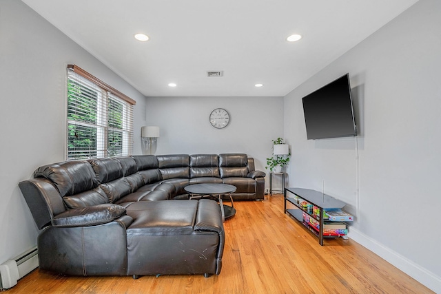 130 W 7th St, Deer Park, NY 11729 - living room featuring baseboard heating, light wood-style floors, recessed lighting, and baseboards
