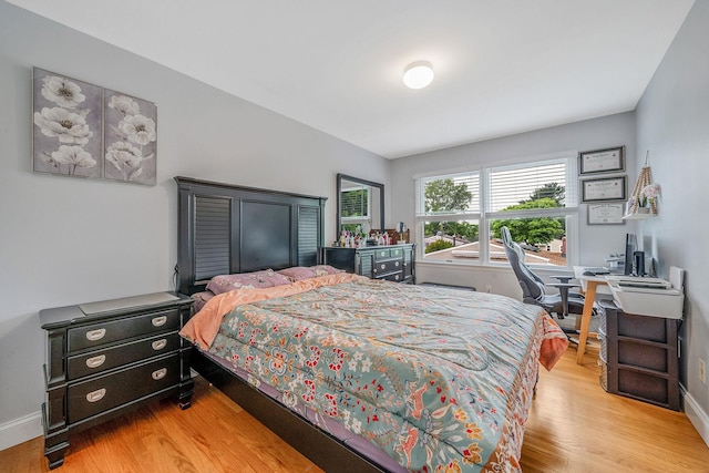 130 W 7th St, Deer Park, NY 11729 - bedroom with wood finished floors, baseboards, and an office area