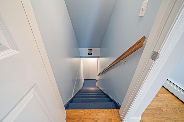 130 W 7th St, Deer Park, NY 11729 - stairway with a baseboard radiator and wood finished floors