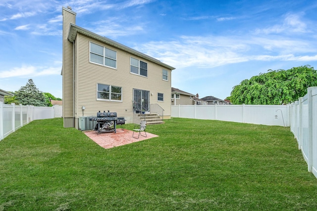 130 W 7th St, Deer Park, NY 11729 - back of property with a chimney and a patio