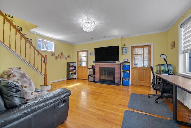 200-12 36th Ave, Bayside, NY 11361 - living area featuring light wood-style flooring, plenty of natural light, a fireplace, a desk, and crown molding