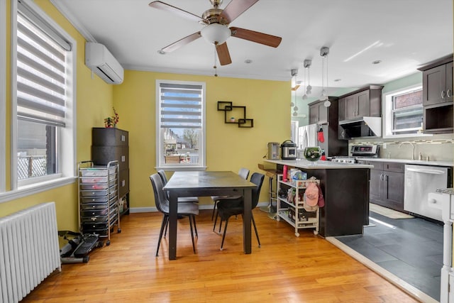 200-12 36th Ave, Bayside, NY 11361 - dining space with radiator, a wall mounted air conditioner, ceiling fan, light wood finished floors, and ornamental molding