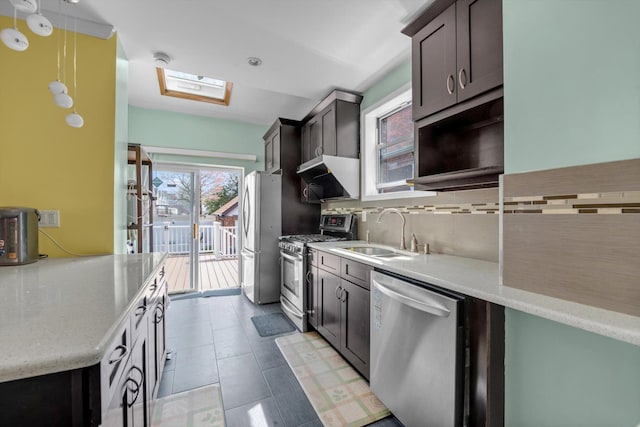 200-12 36th Ave, Bayside, NY 11361 - kitchen featuring stainless steel appliances, a sink, tasteful backsplash, decorative light fixtures, and a skylight
