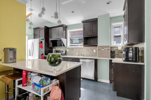 200-12 36th Ave, Bayside, NY 11361 - kitchen with stainless steel dishwasher, fridge with ice dispenser, decorative backsplash, and plenty of natural light