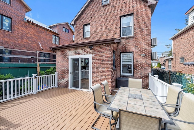 200-12 36th Ave, Bayside, NY 11361 - wooden deck featuring outdoor dining area and central AC unit