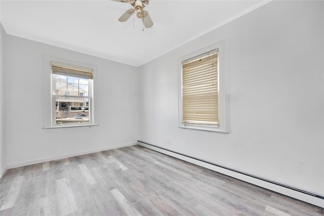 3680 Naomi St, Seaford, NY 11783 - spare room with a baseboard heating unit, wood finished floors, ceiling fan, crown molding, and baseboards