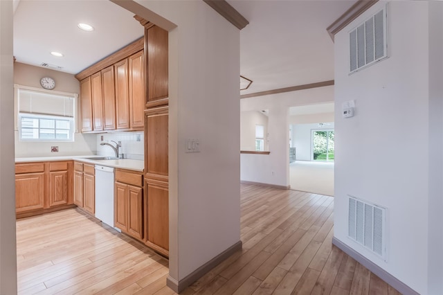 75 Madison Cir, Middle Island, NY 11953 - kitchen featuring white dishwasher, light wood-style flooring, light countertops, tasteful backsplash, and recessed lighting