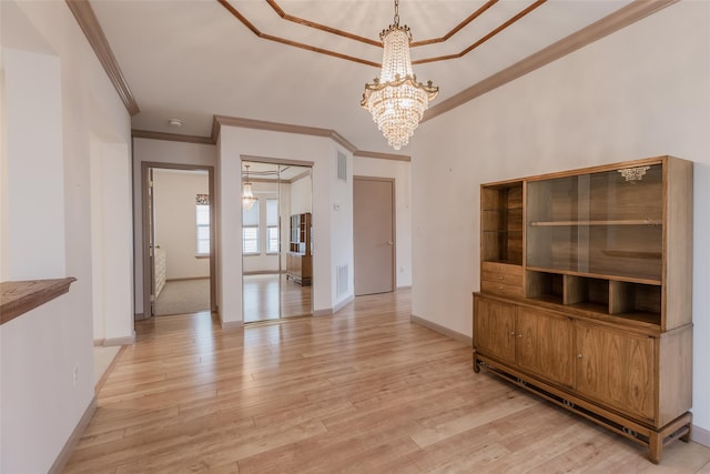 75 Madison Cir, Middle Island, NY 11953 - unfurnished dining area featuring ornamental molding, a chandelier, and light wood finished floors