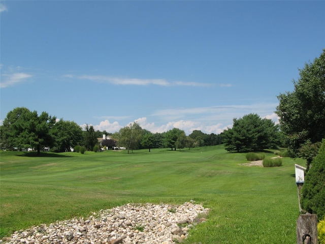 75 Madison Cir, Middle Island, NY 11953 - view of property's community featuring golf course view, a lawn, and view of wooded area