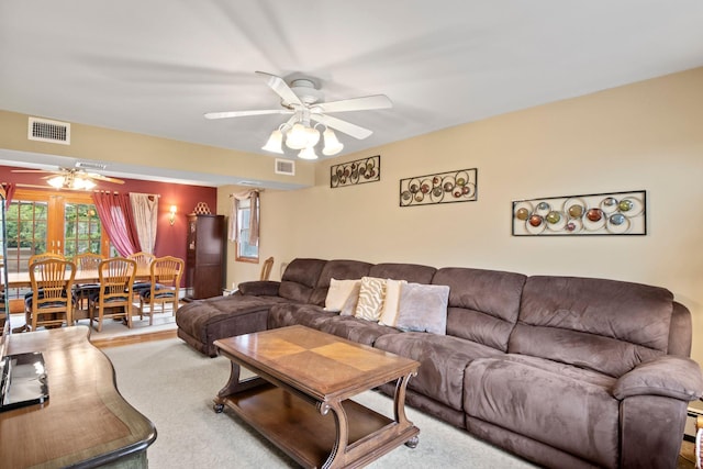 13 Evans Ave, Albertson, NY 11507 - carpeted living area with a ceiling fan