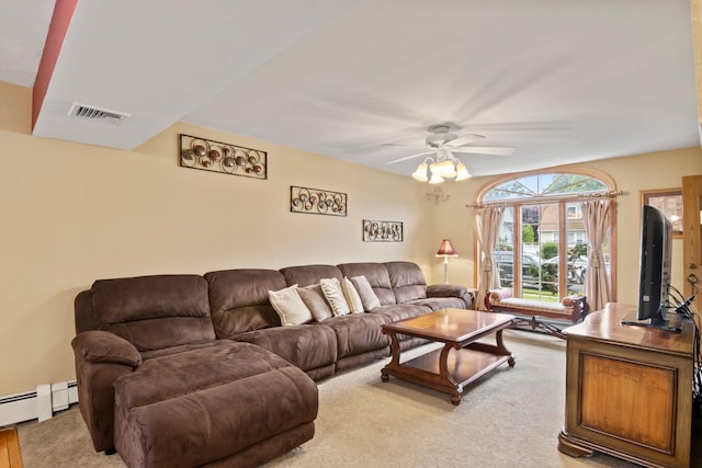 13 Evans Ave, Albertson, NY 11507 - living area with ceiling fan, light carpet, and a baseboard heating unit