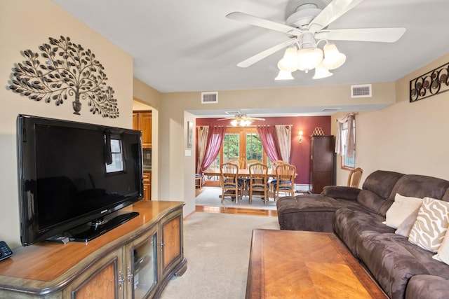 13 Evans Ave, Albertson, NY 11507 - living area featuring a ceiling fan and light carpet