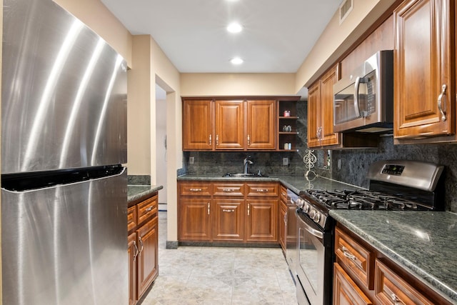 13 Evans Ave, Albertson, NY 11507 - kitchen with appliances with stainless steel finishes, a sink, brown cabinetry, open shelves, and tasteful backsplash