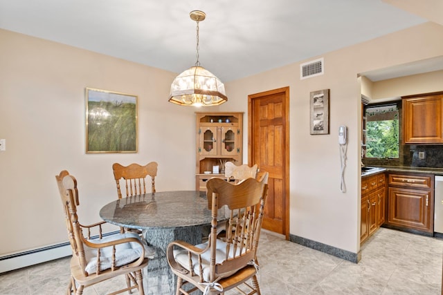 13 Evans Ave, Albertson, NY 11507 - dining area featuring a chandelier and baseboards