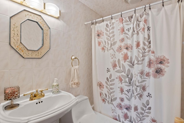 13 Evans Ave, Albertson, NY 11507 - bathroom with tile walls, a sink, and shower / bath combination with curtain