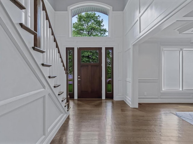 15 Grenfell Dr, Great Neck, NY 11020 - entryway featuring a decorative wall, stairway, and wood finished floors