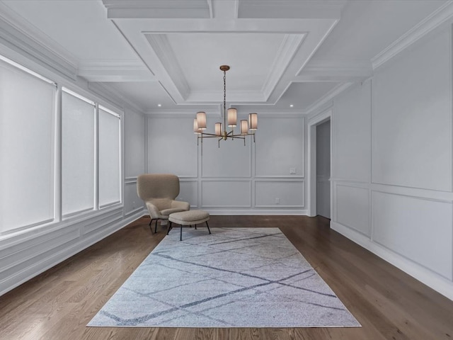 15 Grenfell Dr, Great Neck, NY 11020 - living area featuring a decorative wall, a chandelier, coffered ceiling, dark wood-type flooring, and crown molding