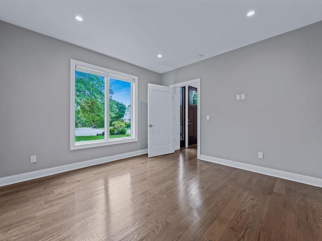 15 Grenfell Dr, Great Neck, NY 11020 - empty room featuring baseboards, wood finished floors, and recessed lighting