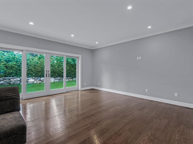 15 Grenfell Dr, Great Neck, NY 11020 - empty room featuring crown molding, baseboards, french doors, recessed lighting, and wood finished floors