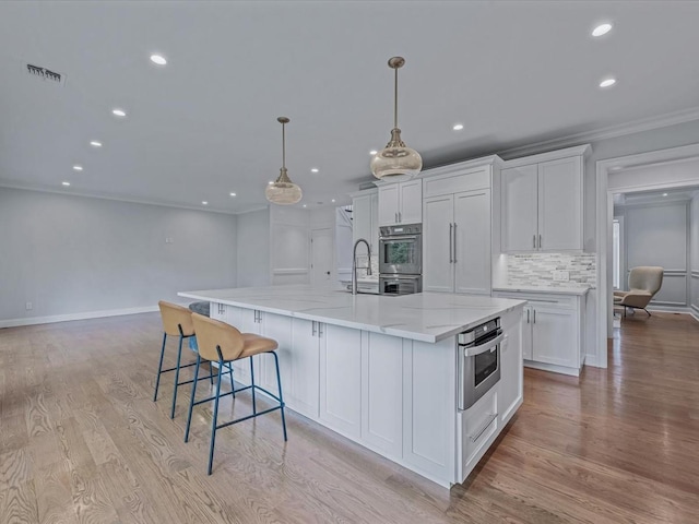15 Grenfell Dr, Great Neck, NY 11020 - kitchen featuring recessed lighting, white cabinetry, stainless steel double oven, decorative backsplash, and ornamental molding