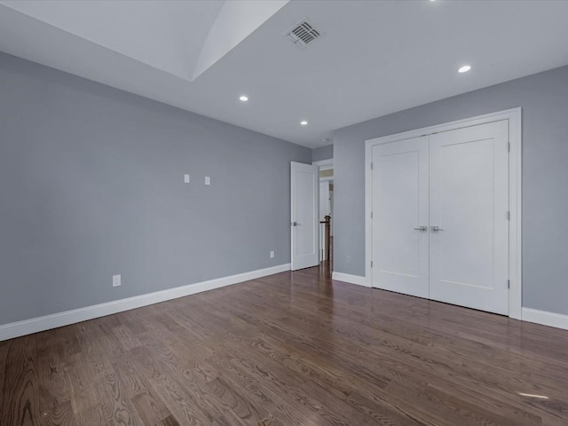 15 Grenfell Dr, Great Neck, NY 11020 - unfurnished bedroom with wood finished floors, baseboards, recessed lighting, and a closet