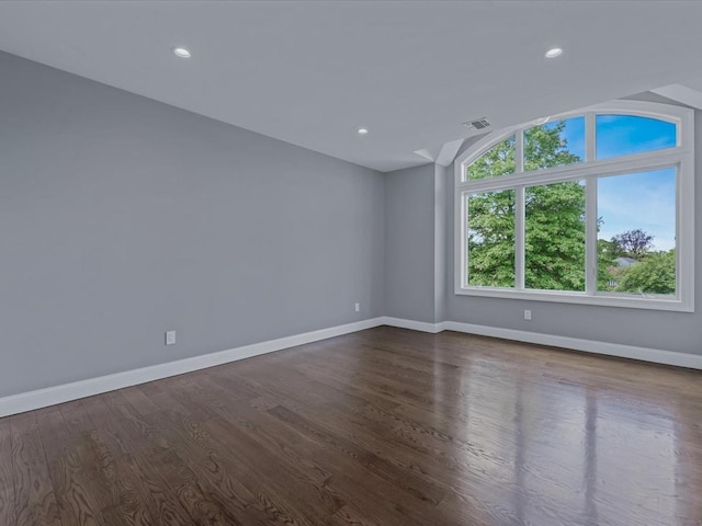 15 Grenfell Dr, Great Neck, NY 11020 - empty room with baseboards, vaulted ceiling, dark wood finished floors, and recessed lighting