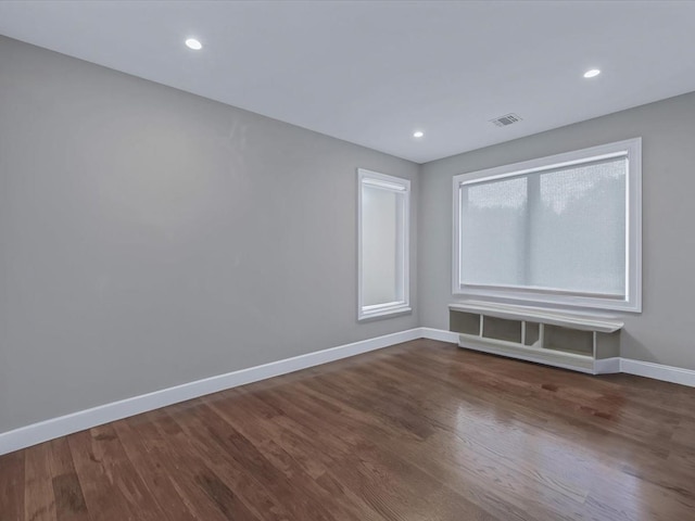 15 Grenfell Dr, Great Neck, NY 11020 - unfurnished room with baseboards, wood finished floors, and recessed lighting