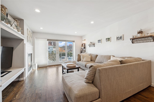 149 Monroe Blvd Unit 149, Long Beach, NY 11561 - living area with dark wood-style floors, recessed lighting, and a glass covered fireplace