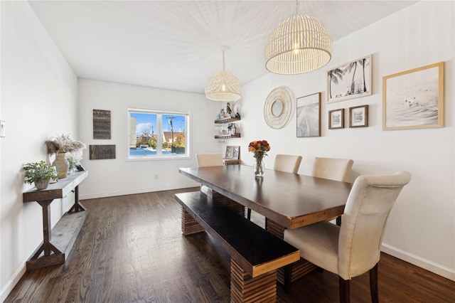 149 Monroe Blvd Unit 149, Long Beach, NY 11561 - dining area with baseboards, dark wood-type flooring, and a chandelier