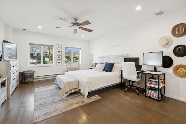149 Monroe Blvd Unit 149, Long Beach, NY 11561 - bedroom featuring baseboard heating, dark wood finished floors, recessed lighting, ceiling fan, and an office area