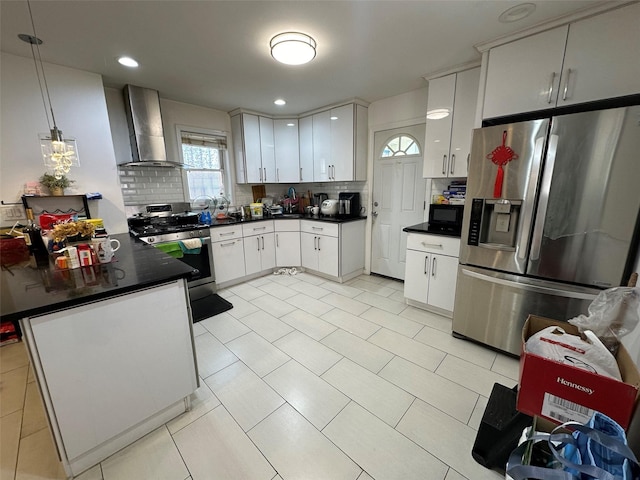 5224 66th St, Maspeth, NY 11378 - kitchen with stainless steel appliances, wall chimney range hood, tasteful backsplash, and dark countertops