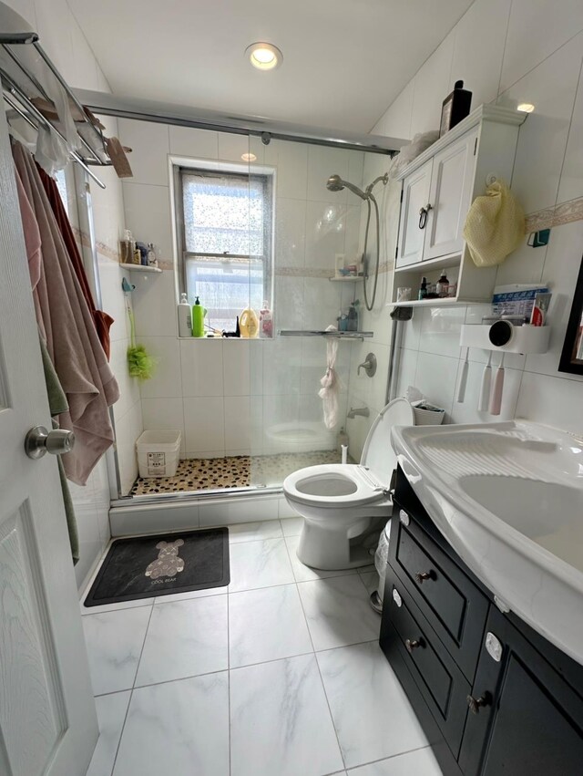 5224 66th St, Maspeth, NY 11378 - bathroom featuring toilet, a shower stall, vanity, tile walls, and recessed lighting