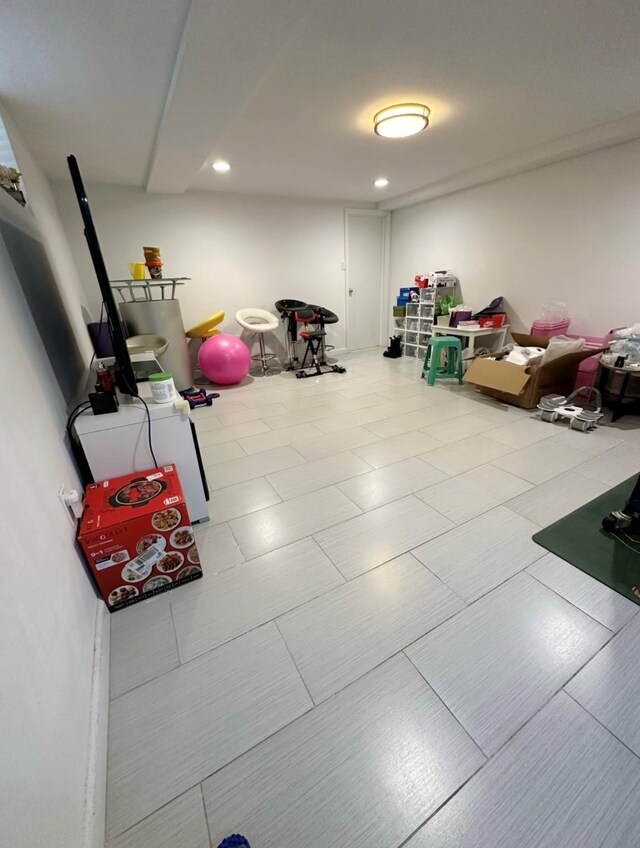 5224 66th St, Maspeth, NY 11378 - finished basement featuring water heater and recessed lighting