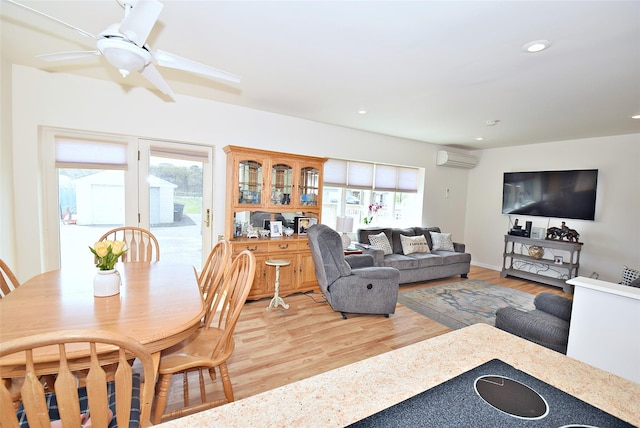 32 Shore Dr, Mastic Beach, NY 11951 - living room with an AC wall unit, light wood-style flooring, ceiling fan, and recessed lighting