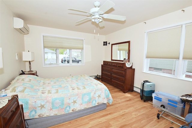 32 Shore Dr, Mastic Beach, NY 11951 - bedroom featuring an AC wall unit, wood finished floors, a baseboard radiator, and a ceiling fan