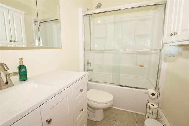32 Shore Dr, Mastic Beach, NY 11951 - full bath with toilet, vanity, bath / shower combo with glass door, and tile patterned floors
