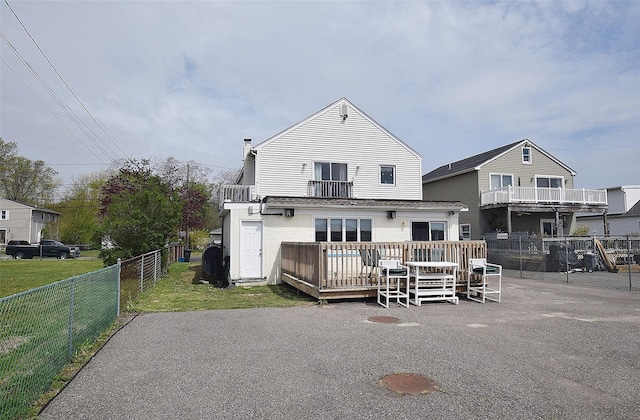 32 Shore Dr, Mastic Beach, NY 11951 - back of house with a wooden deck and a balcony