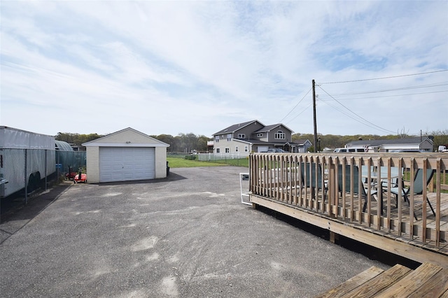 32 Shore Dr, Mastic Beach, NY 11951 - exterior space with an outbuilding, a garage, a residential view, and driveway