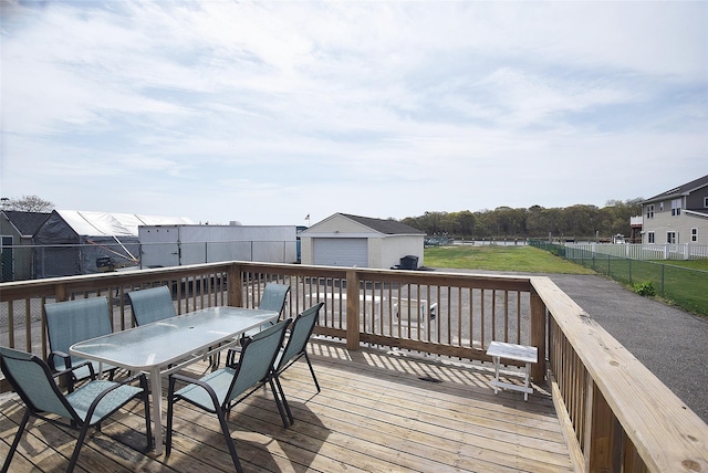 32 Shore Dr, Mastic Beach, NY 11951 - wooden deck featuring outdoor dining area, an outdoor structure, and a detached garage