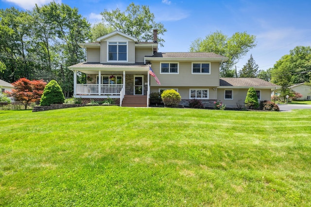 40 Pine St, New City, NY 10956 - split level home featuring covered porch, a front lawn, and a chimney