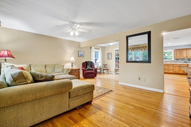 40 Pine St, New City, NY 10956 - living area featuring light wood-style flooring, ceiling fan, and healthy amount of natural light