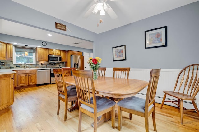 40 Pine St, New City, NY 10956 - dining room featuring light wood-style floors, wainscoting, and ceiling fan