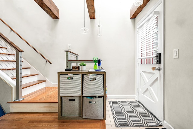 110-25 64th Rd Unit 10, Forest Hills, NY 11375 - foyer featuring stairs, baseboards, beamed ceiling, and tile patterned flooring