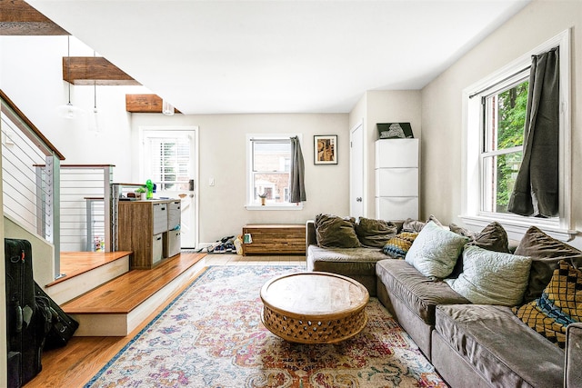 110-25 64th Rd Unit 10, Forest Hills, NY 11375 - living area featuring plenty of natural light, wood finished floors, and stairway