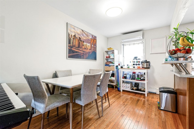 110-25 64th Rd Unit 10, Forest Hills, NY 11375 - dining area with a wall mounted AC and light wood-style flooring