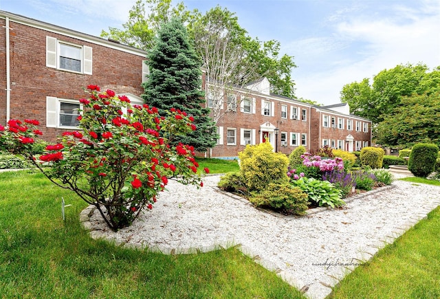 110-25 64th Rd Unit 10, Forest Hills, NY 11375 - exterior space with brick siding and a lawn