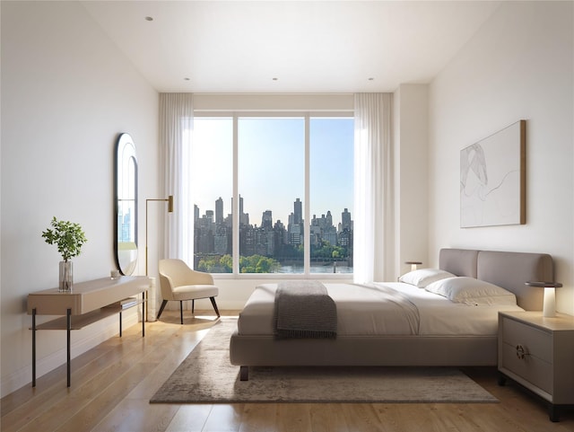 30-55 Vernon Blvd Unit 9L, Long Island City, NY 11102 - bedroom with multiple windows, wood finished floors, and a view of skyline
